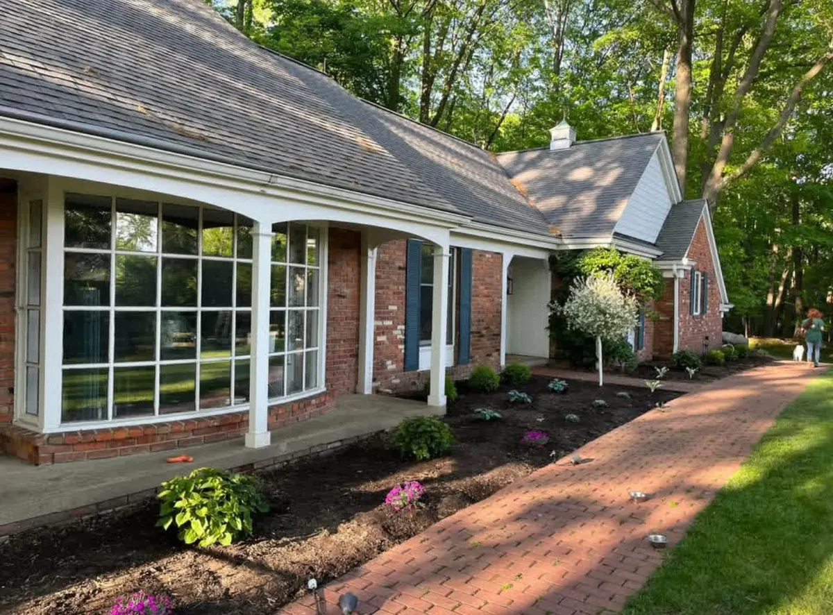 Brick home with paver walkway and landscaped beds in South Russell, Ohio