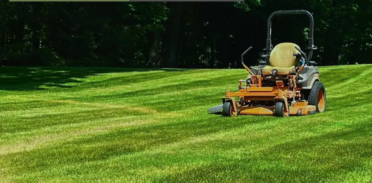 Scag zero-turn mower on a freshly striped Northeast Ohio lawn